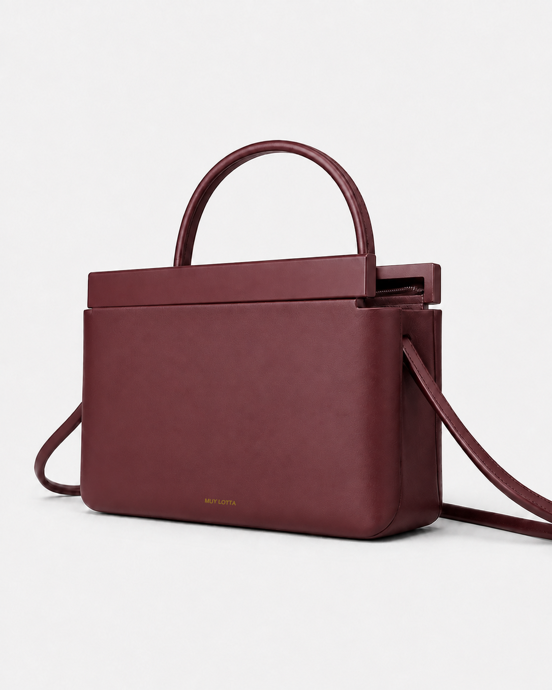 MUYLOTTA ML-MN01 oxblood mini top-handle bag, three-quarter view, with a rounded handle and deliberately open top frame.