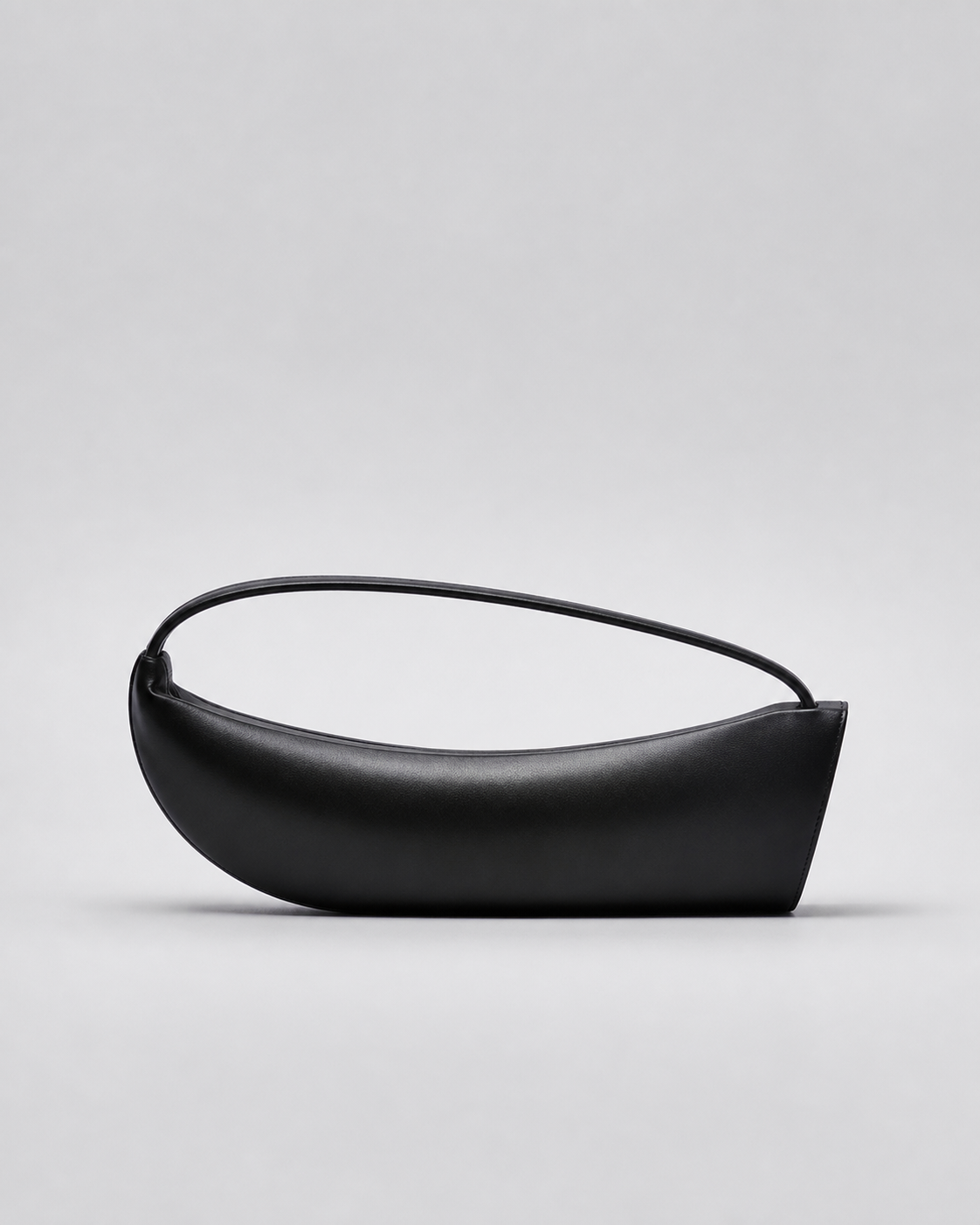 MUYLOTTA ML-MN14 cool black thin moon bag, front view with one short flat plane interrupting the right curve