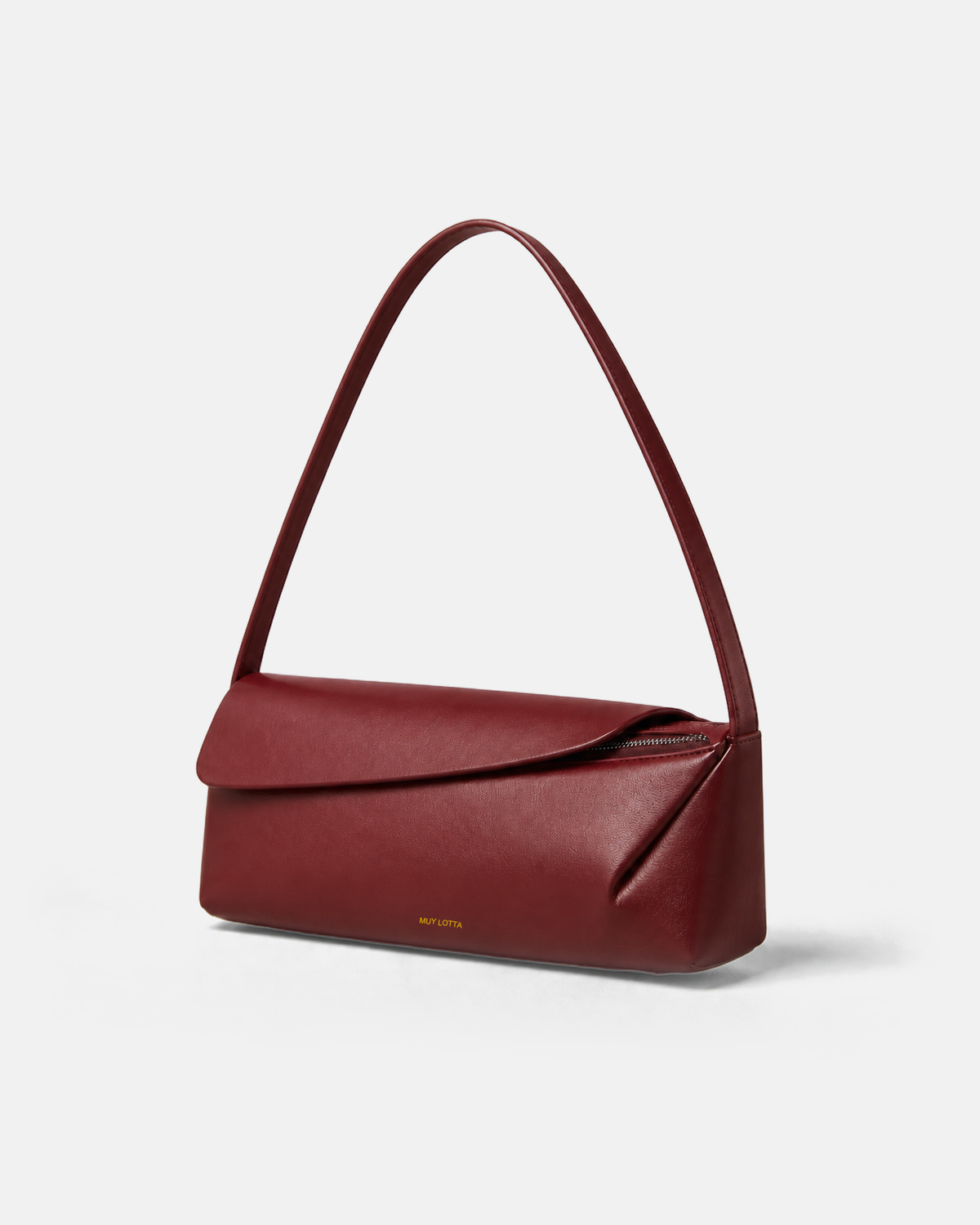 MUYLOTTA ML-SH06 oxidized red shoulder bag, three-quarter view with a low body and right-offset overlapping top shell.