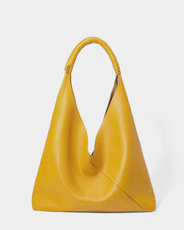 #Yellow leather triangular hobo shoulder bag front view with soft draped silhouette