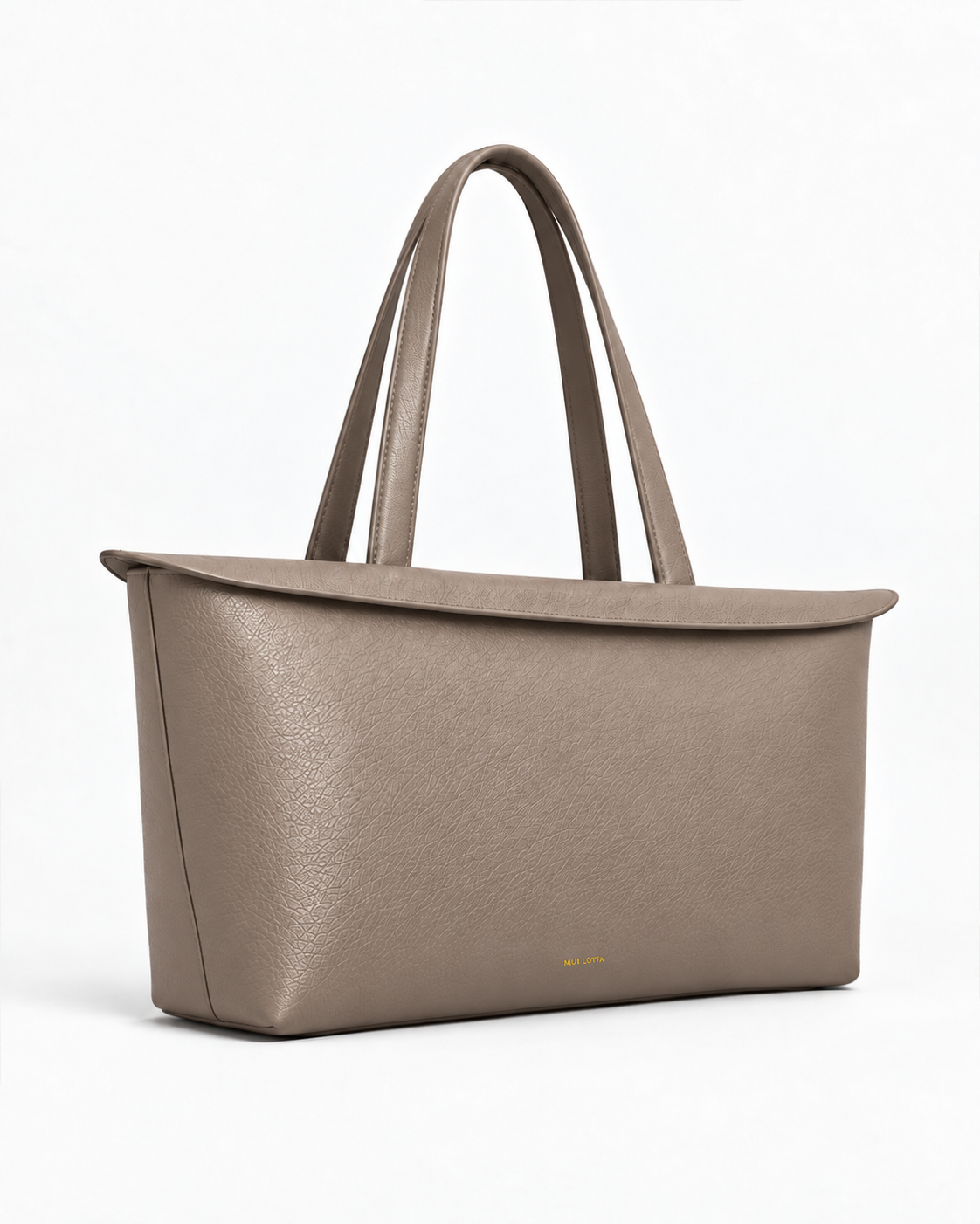 Three-quarter side view of the MUY LOTTA Floating Eave Span Limestone Taupe leather tote.