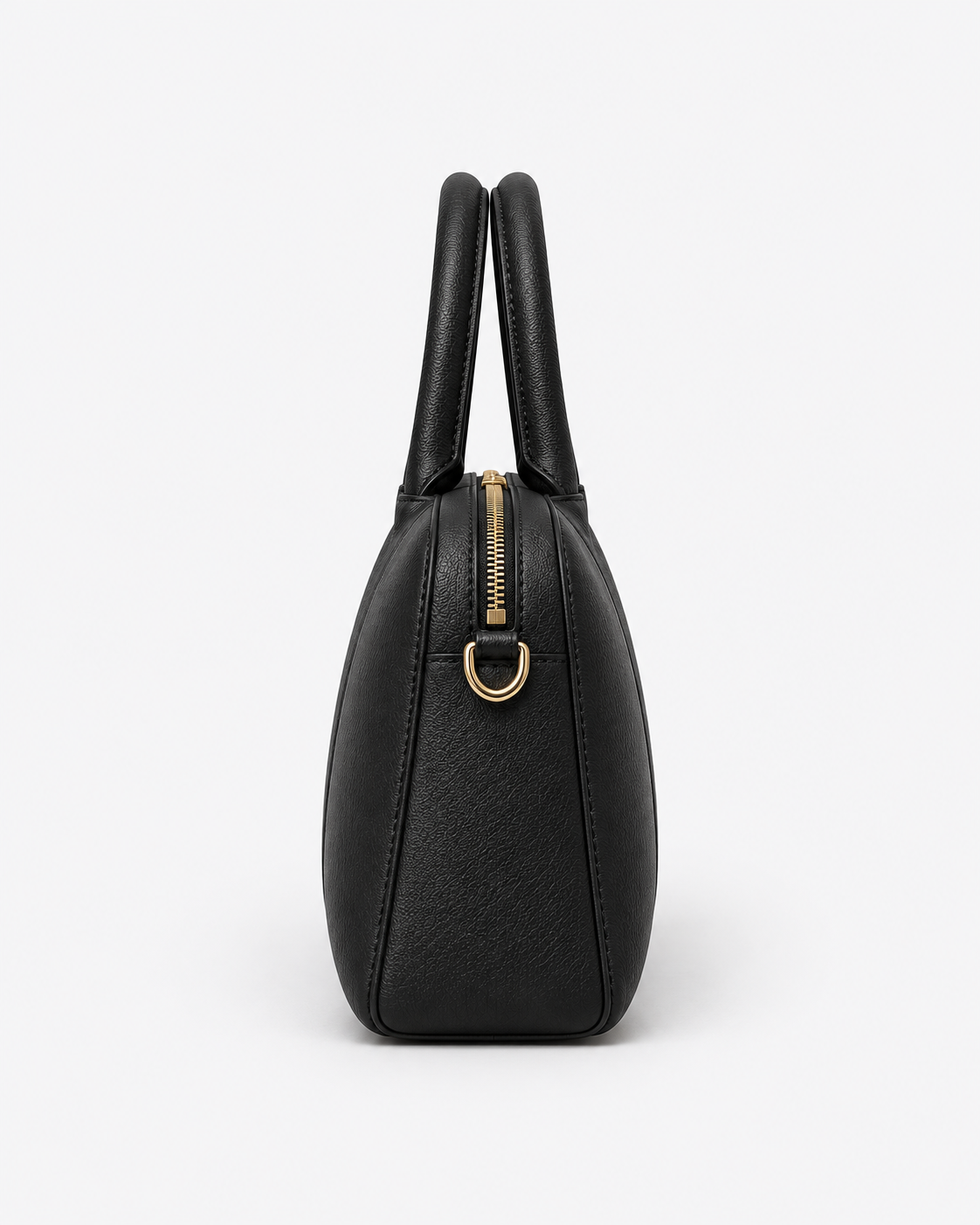 Side profile of the black MUY LOTTA baguette bag showing the top zipper and gold-tone D-ring.