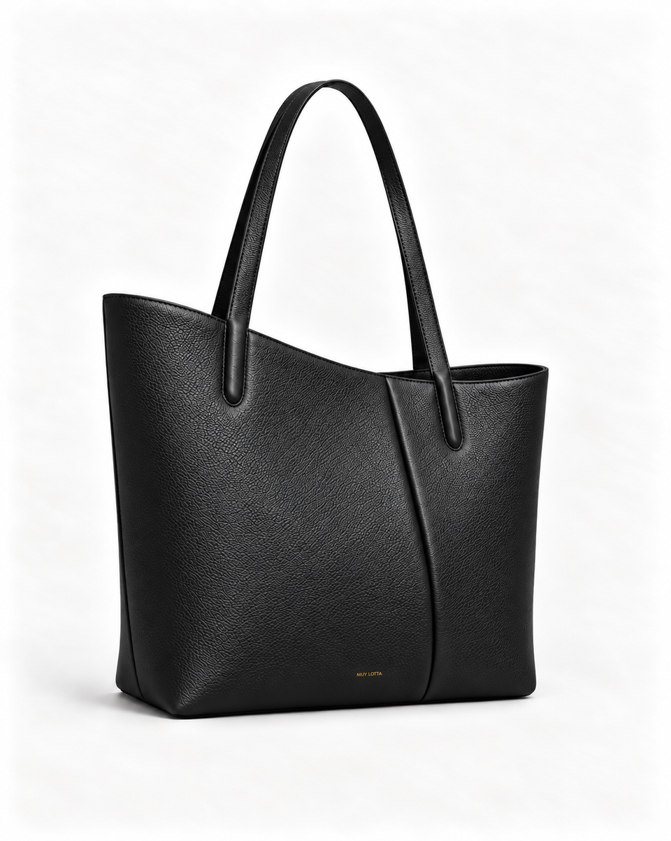 MUY LOTTA VEER Axis Black asymmetric leather work tote, three-quarter front view.