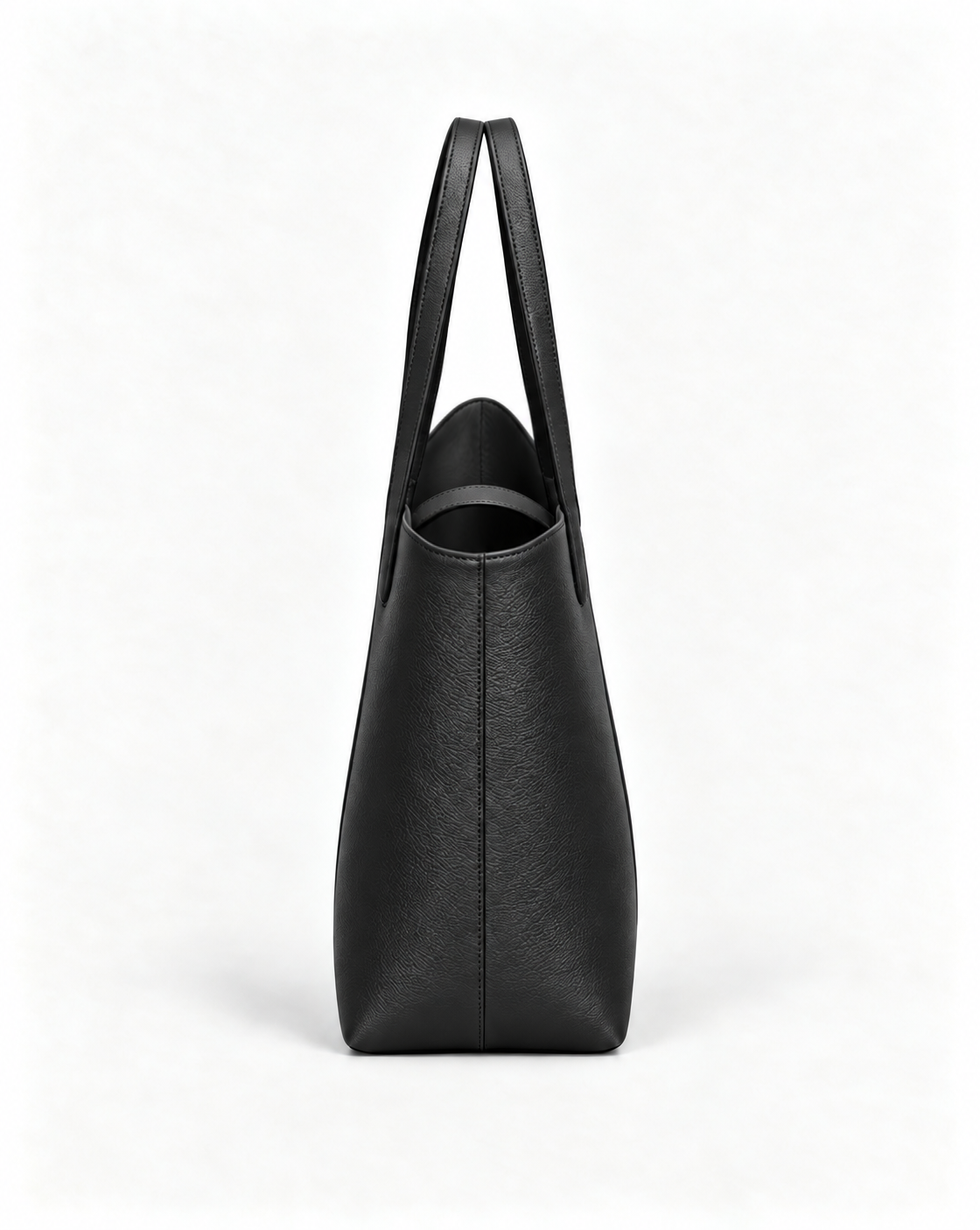 Side view of the MUY LOTTA VEER Axis Black asymmetric leather tote.