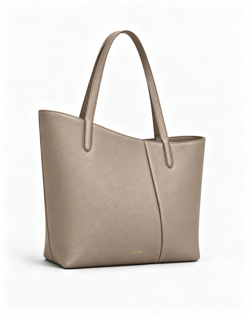 MUY LOTTA VEER Axis Gray Taupe asymmetric leather work tote, three-quarter front view.